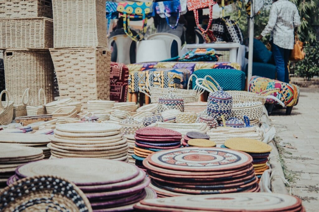 pexels-photo-20164064 Colorful handmade baskets and trays displayed at an outdoor market in Abuja, Nigeria.